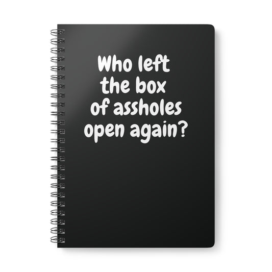 black notebook with sarcastic “Who left the box of assholes open again?” quote