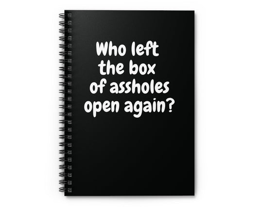 Black spiral notebook with sarcastic “Who left the box of assholes open again?” quote