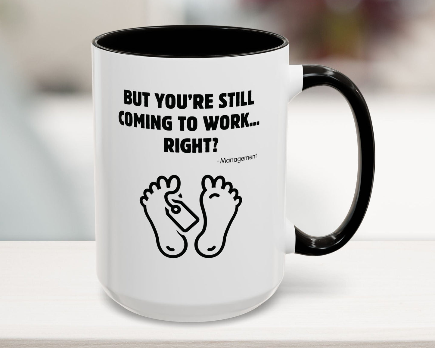 Mug with humorous text and foot illustrations on a blurred background