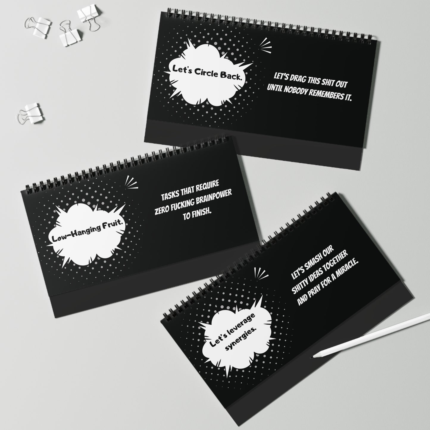 Three black spiral-bound pages with white text on a gray background