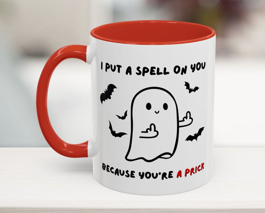 Mug with ghost illustration and text on a white surface