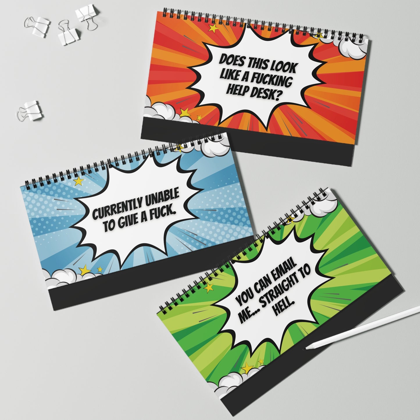 Three desk sign pages with colorful designs and text on a gray background