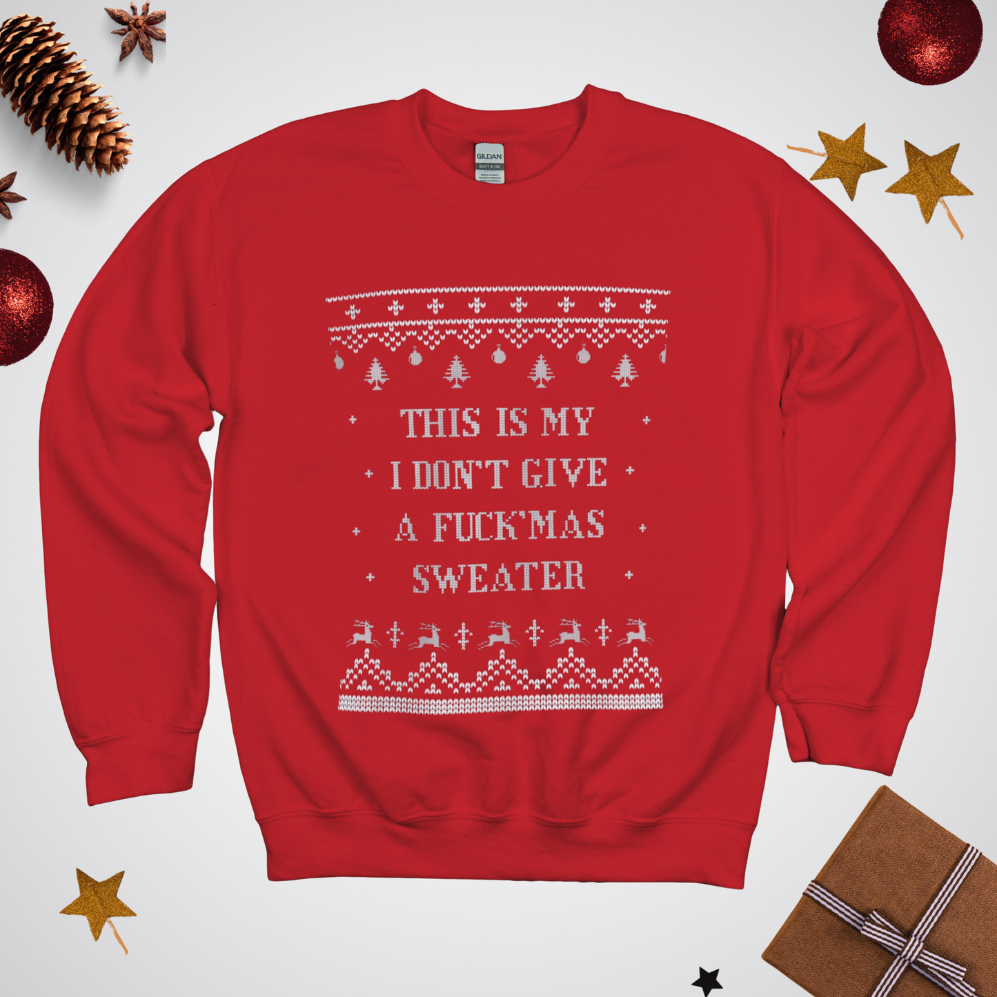 Red sweater with Christmas-themed text and patterns on a white background with festive decorations.