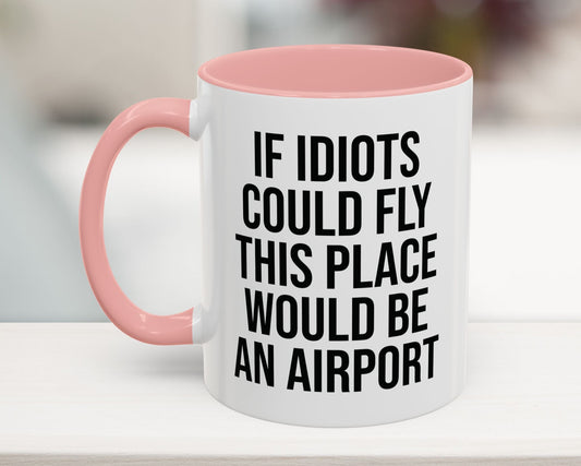 Pink 11oz funny work mug with 'If Idiots Could Fly, This Place Would Be an Airport' text – sarcastic office coffee cup