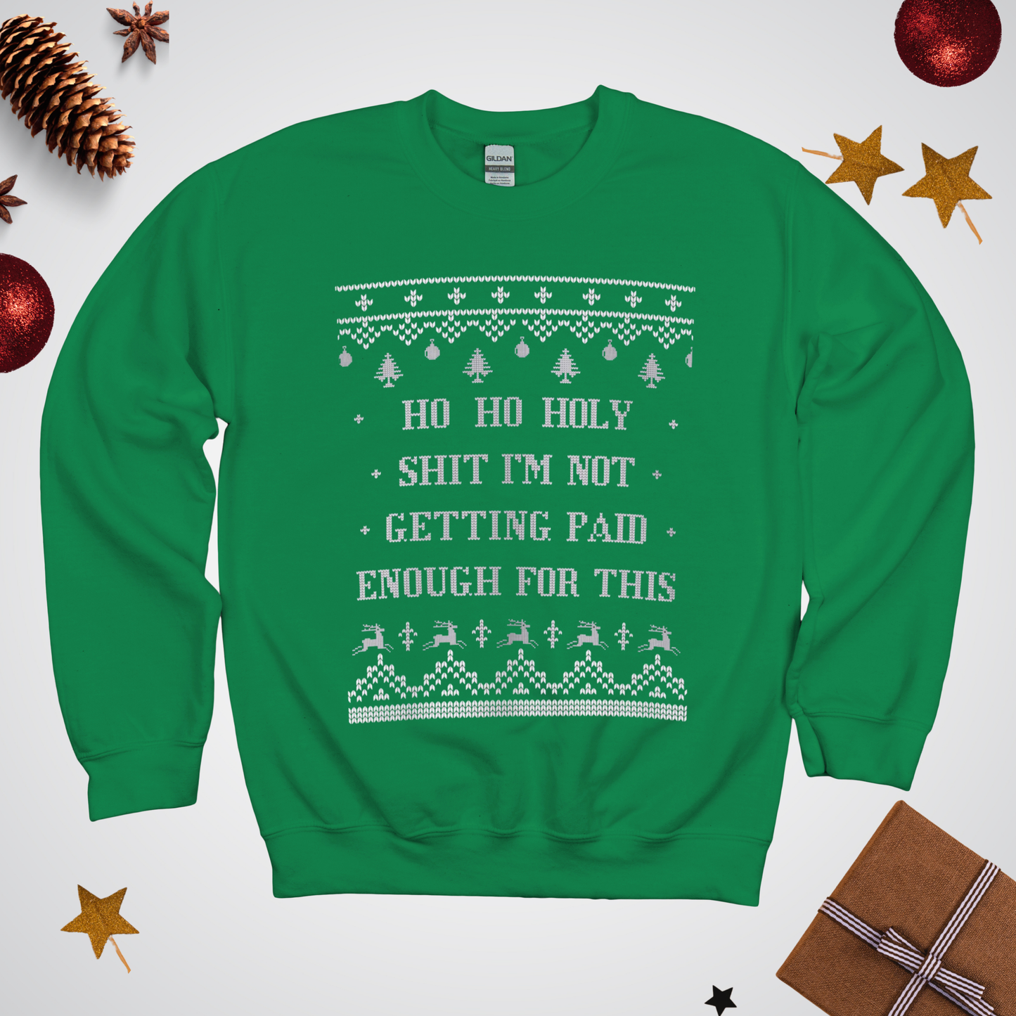 Green sweater with Christmas-themed text and graphics on a white background with festive decorations.