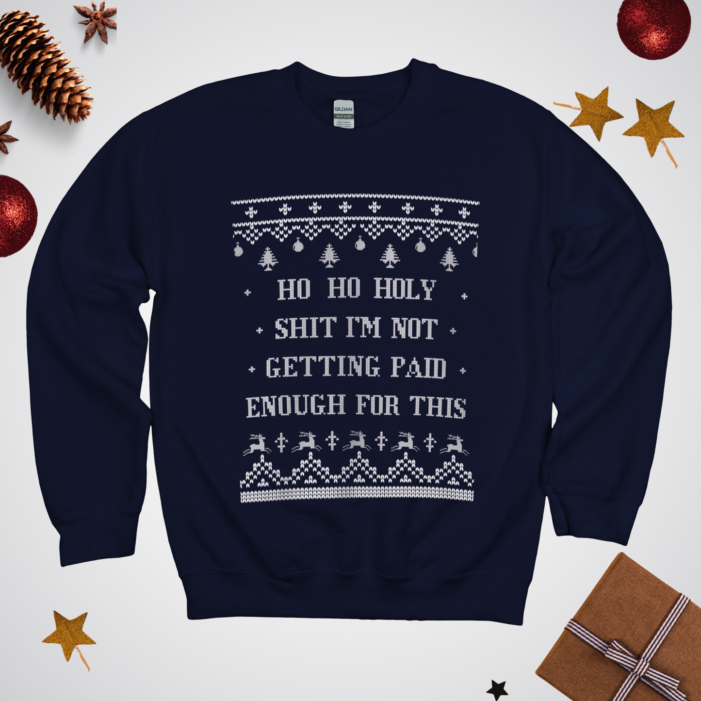 Navy blue sweater with Christmas-themed text and graphics on a white background with festive decorations.