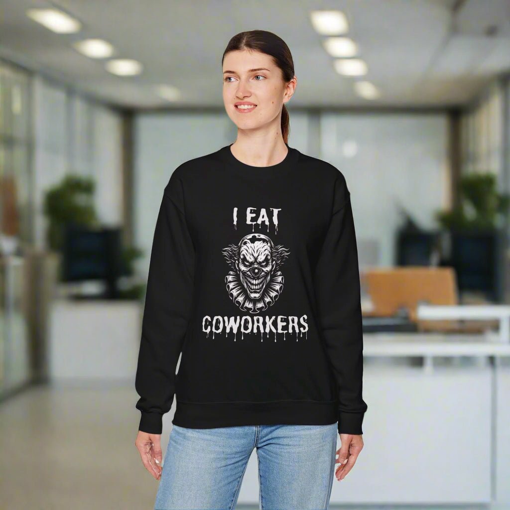 Person wearing a black sweatshirt with a graphic design and text on a white background