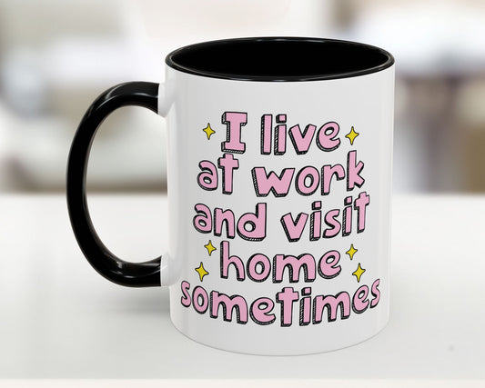 White mug with black handle featuring pink text on a blurred background