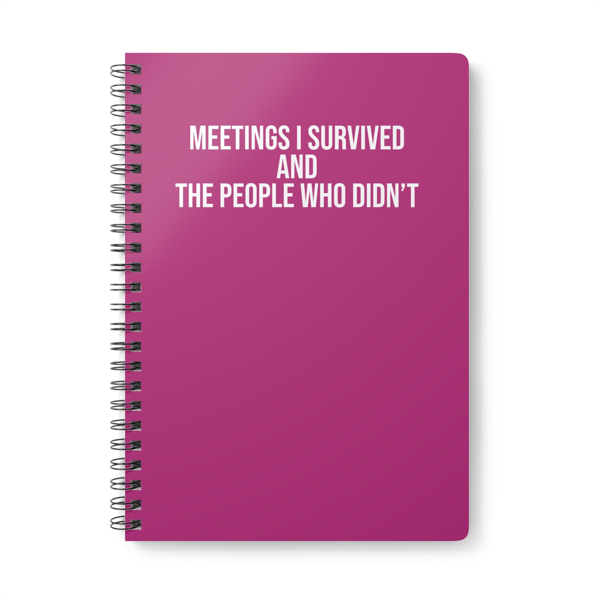Pink notebook with text 'Meetings I Survived and the People Who Didn't' on a white background