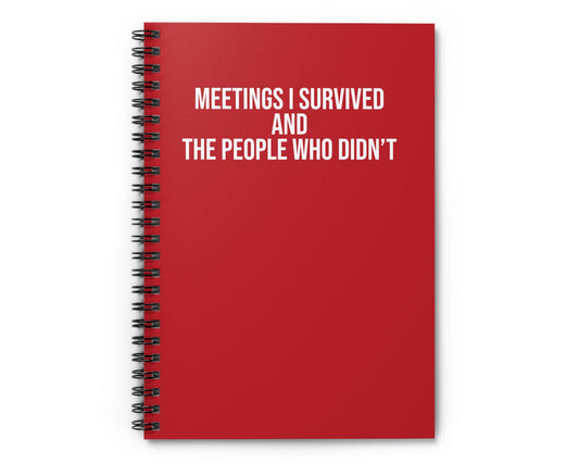 Red notebook with white text on a white background