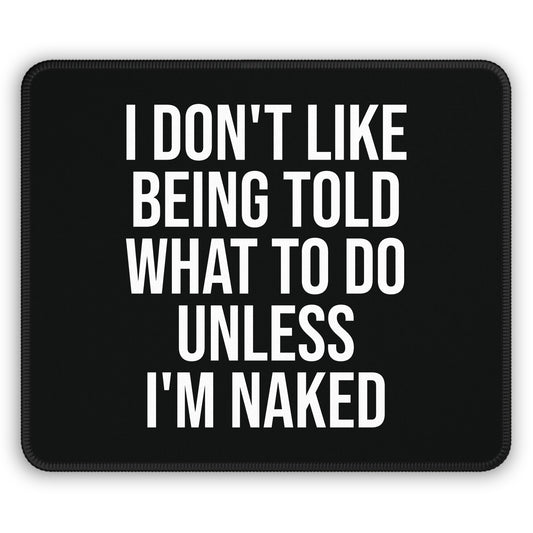 Black mouse pad with “I Don’t Like Being Told What To Do Unless I’m Naked” quote