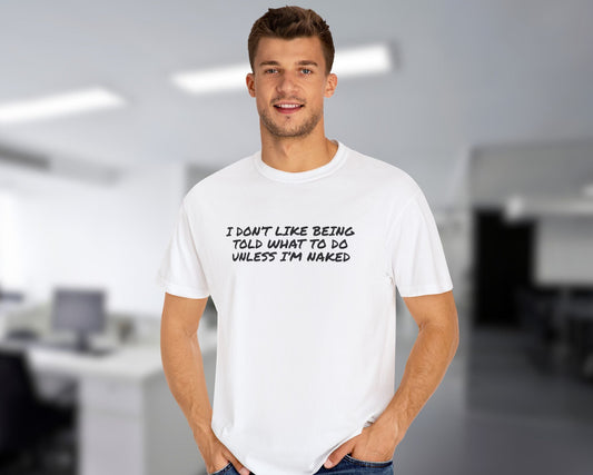 Man wearing white t-shirt with cheeky quote about being told what to do