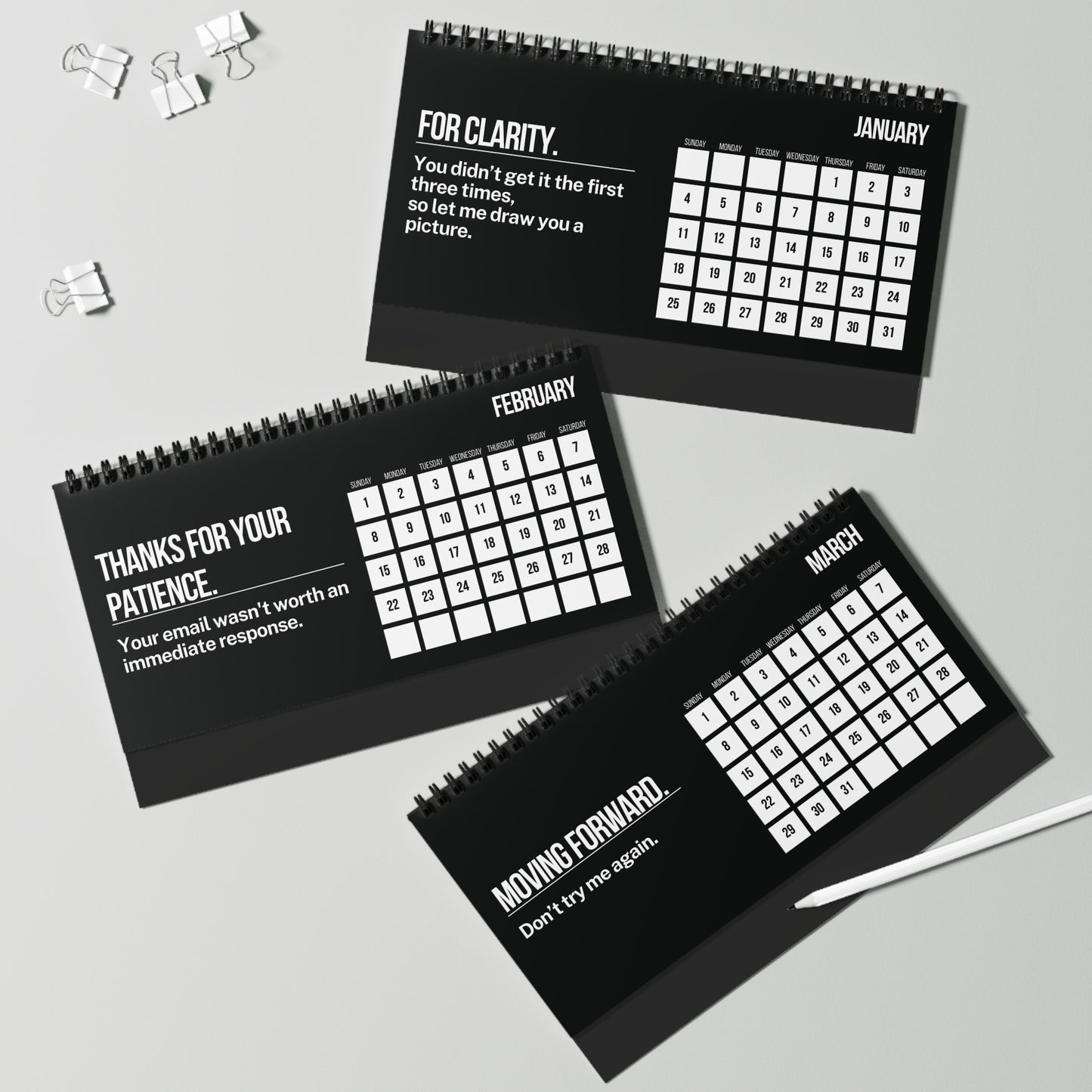 Three black spiral-bound calendars for January, February, and March on a light gray background.