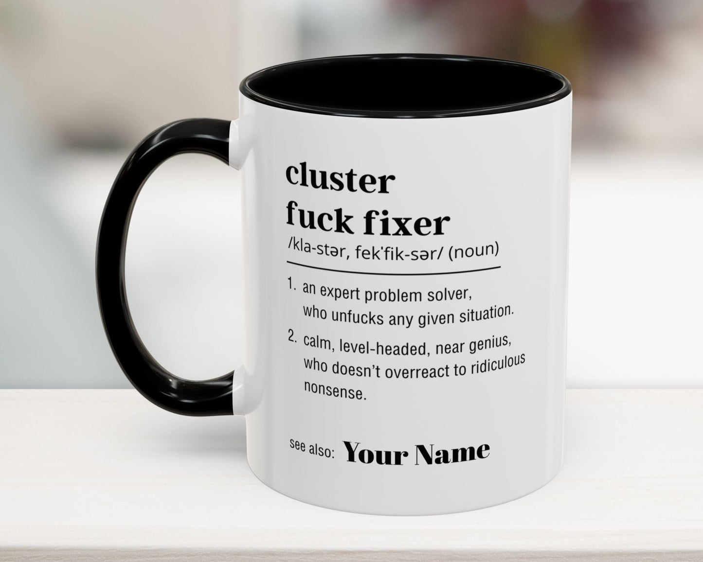 Personalized 'Cluster Fuck Fixer' coffee mug in black – funny office definition gift