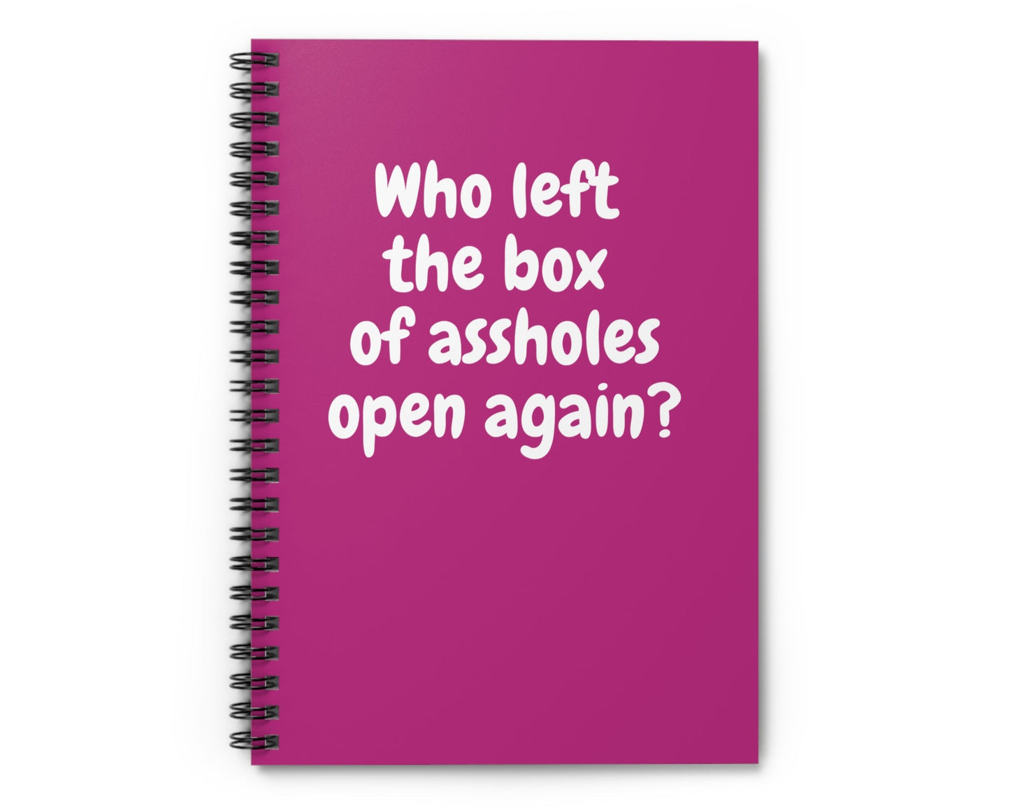 pink spiral notebook with sarcastic “Who left the box of assholes open again?” quote
