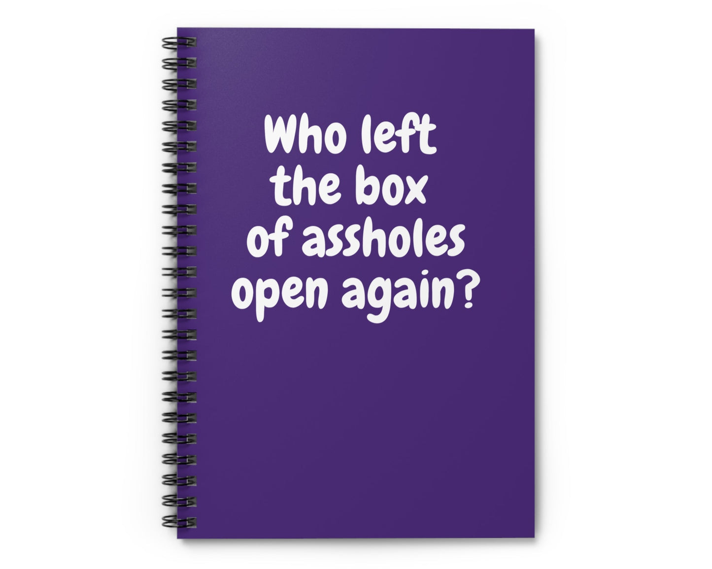 purple spiral notebook with sarcastic “Who left the box of assholes open again?” quote