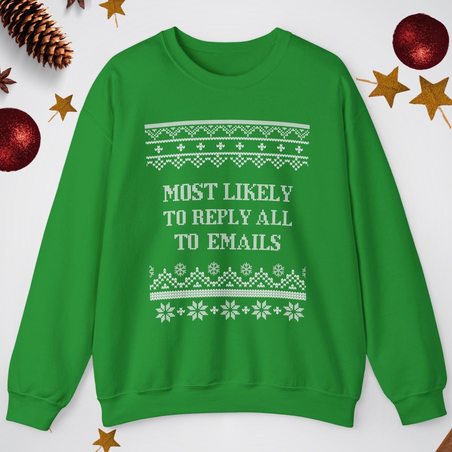 Green sweater with text 'Most Likely to Reply All to Emails' on a white background with Christmas decorations.
