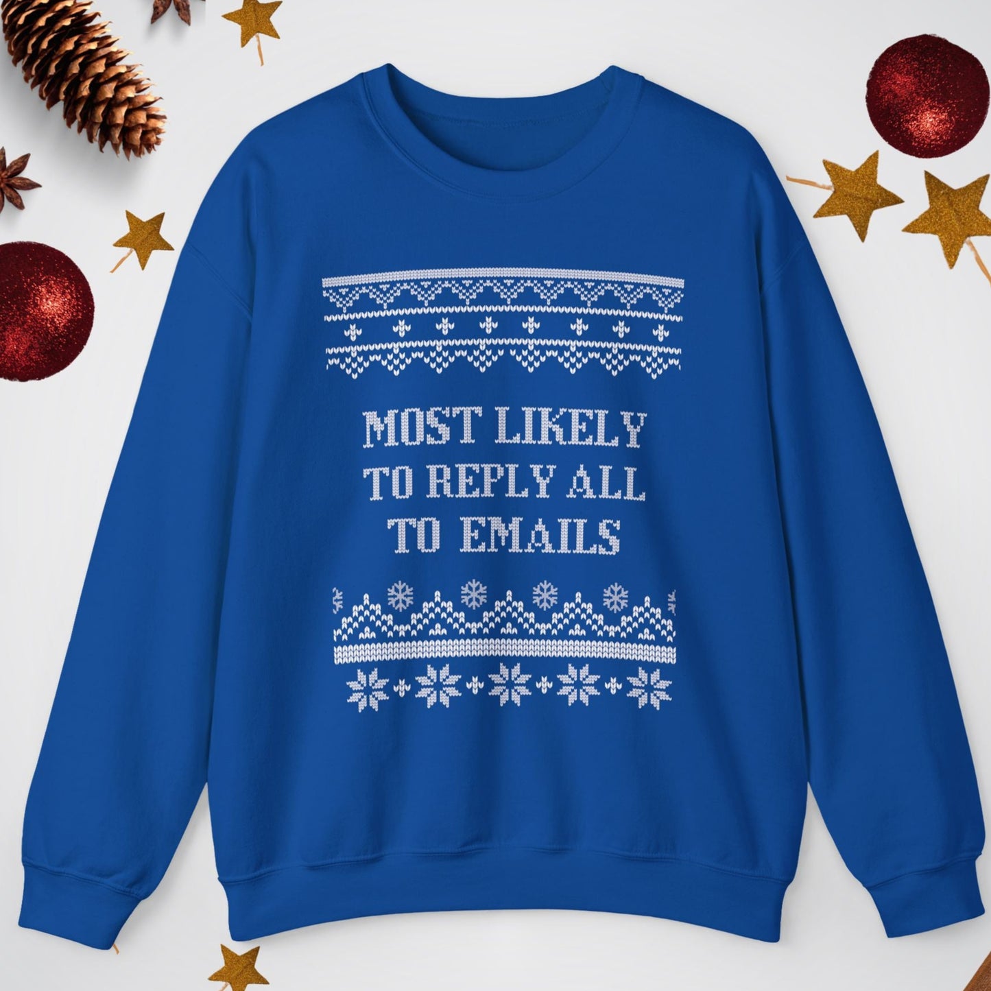 Blue sweater with text and patterns on a light gray background with decorative items.
