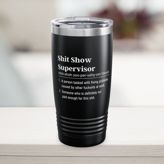 shit show supervisor Black tumbler with text on a blurred background