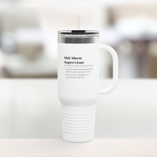 Shit Show Supervisor White travel mug with text on a blurred background
