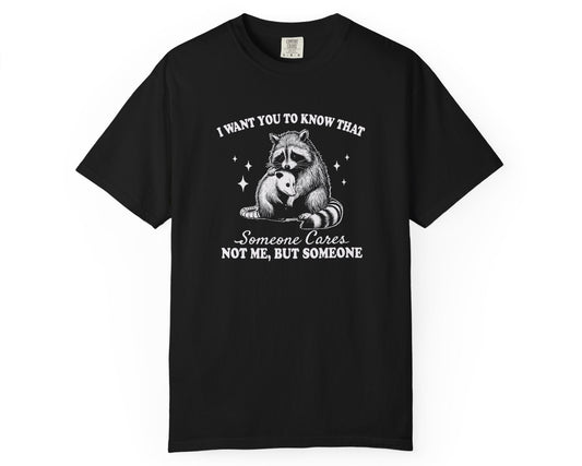 Black unisex T-shirt with raccoon hugging possum and quote: ‘Someone Cares Not Me But Someone’