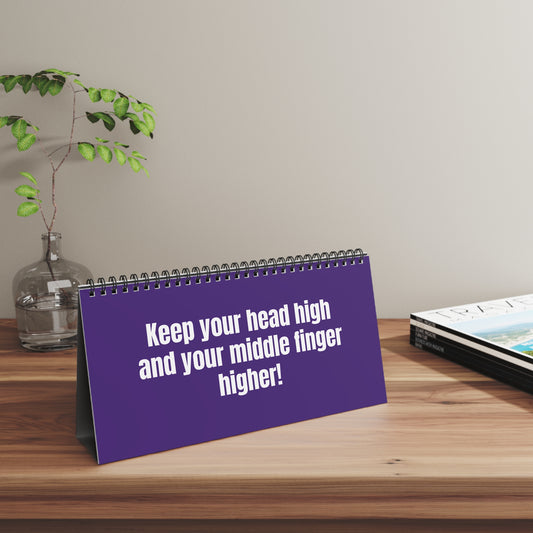 Flip desk sign in purple reading ‘Straighten Your F*cking Crown’ on a work desk 2