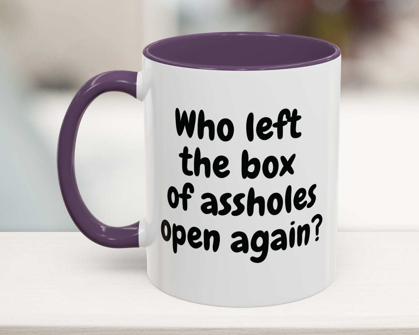 Purple 11oz mug with “Who left the box of assholes open again?” quote