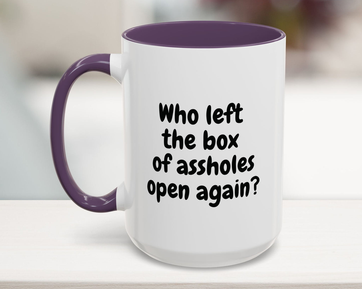 Purple 15oz mug with “Who left the box of assholes open again?” quote