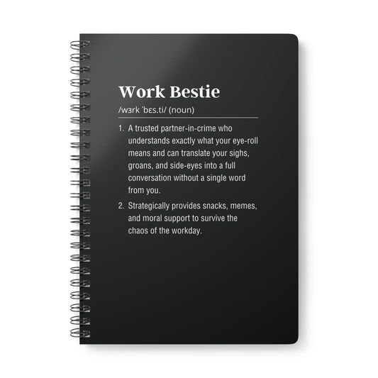 Black notebook with 'Work Bestie' definition on a white background
