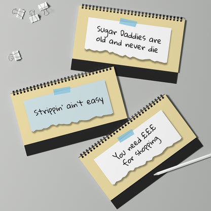 Three spiral-bound notebooks with text on a gray background