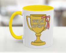 Mug with yellow interior and handle, featuring a trophy design with 'Aspiring Retiree' text.