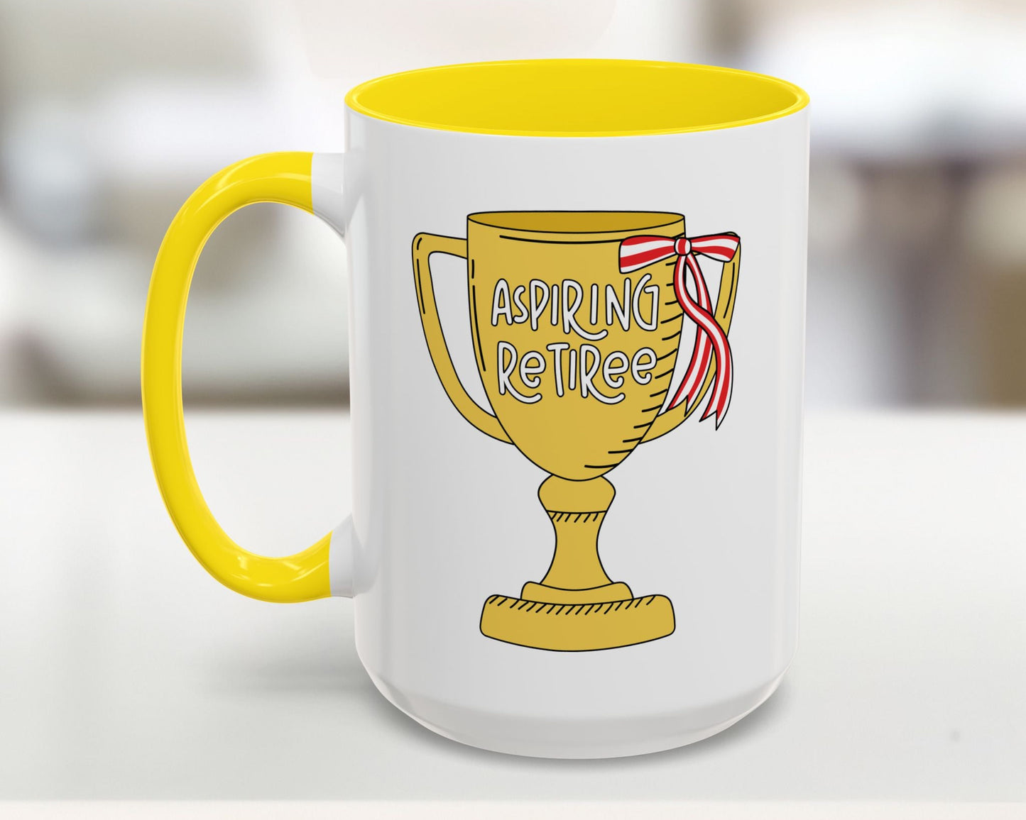 Mug with yellow interior and handle, featuring a trophy design with 'Aspiring Retiree' text.