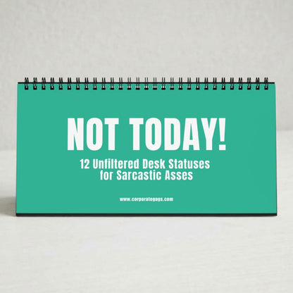 A spiral-bound desk calendar or notebook with a bright teal cover and bold white text reading 'NOT TODAY! 12 Unfiltered Desk Statuses for Sarcastic Asses' on a light neutral background.