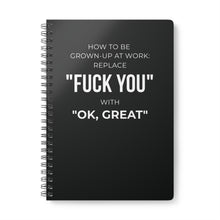Black notebook with white text on a white background