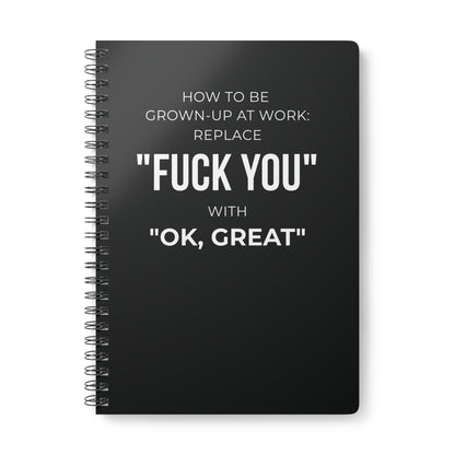 Black notebook with white text on a white background