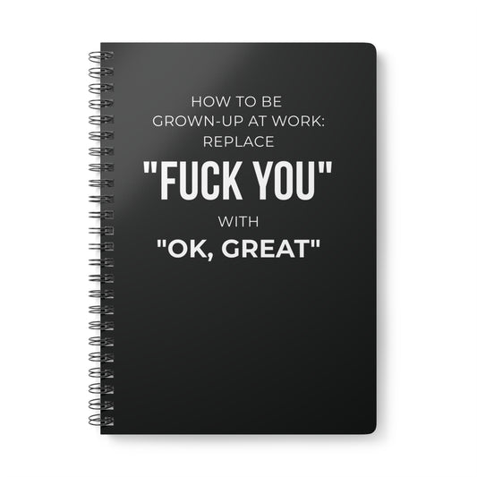 Black notebook with white text on a white background