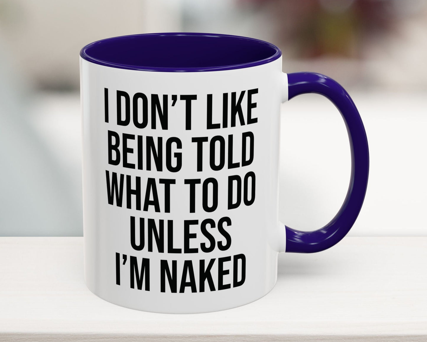 White mug with purple interior and handle, featuring a humorous quote.
