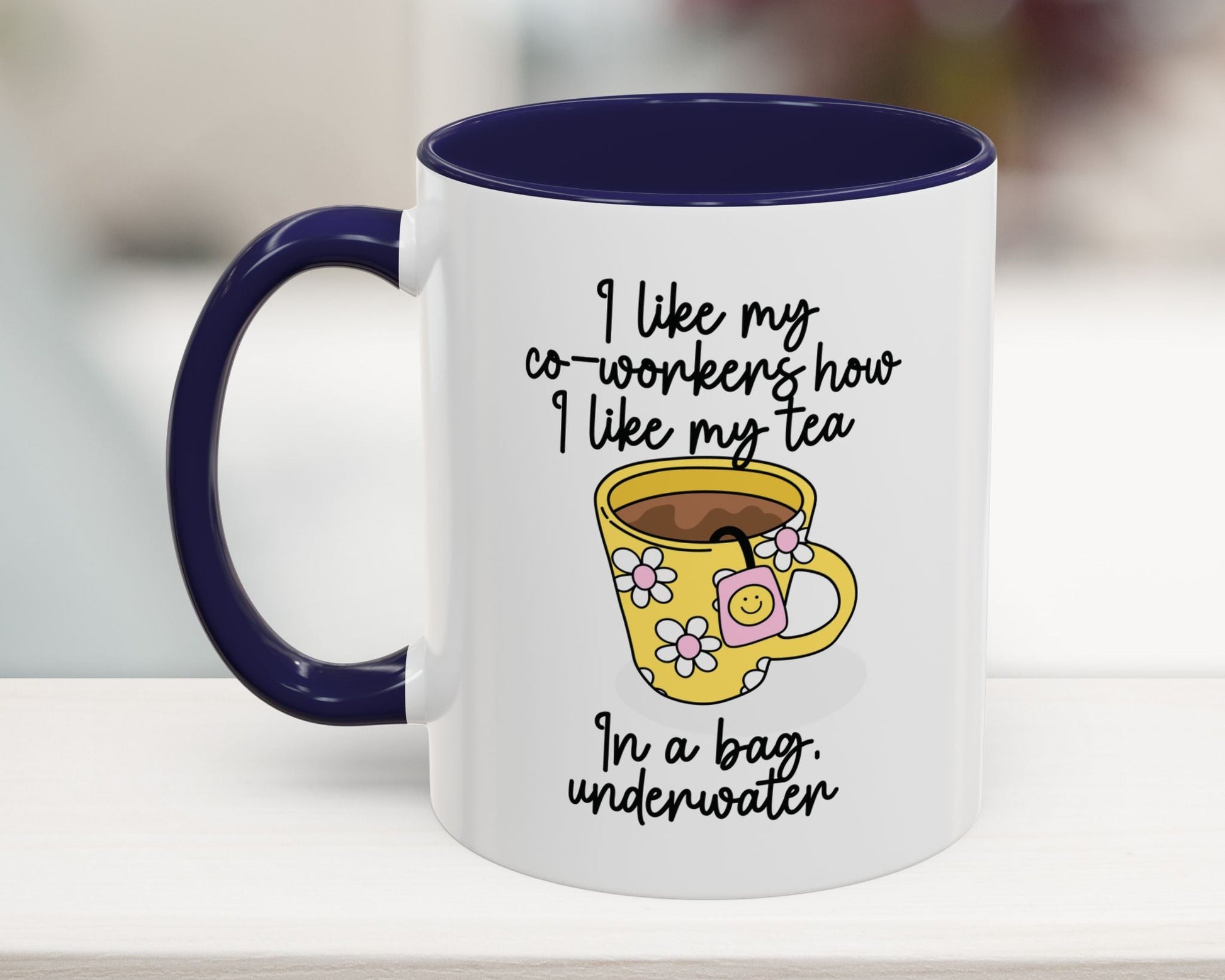 White mug with blue interior and handle, featuring a yellow cartoon cup and humorous text.