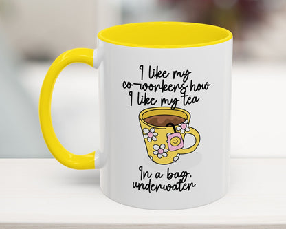White mug with yellow handle and interior, featuring a cartoon cup and humorous text.