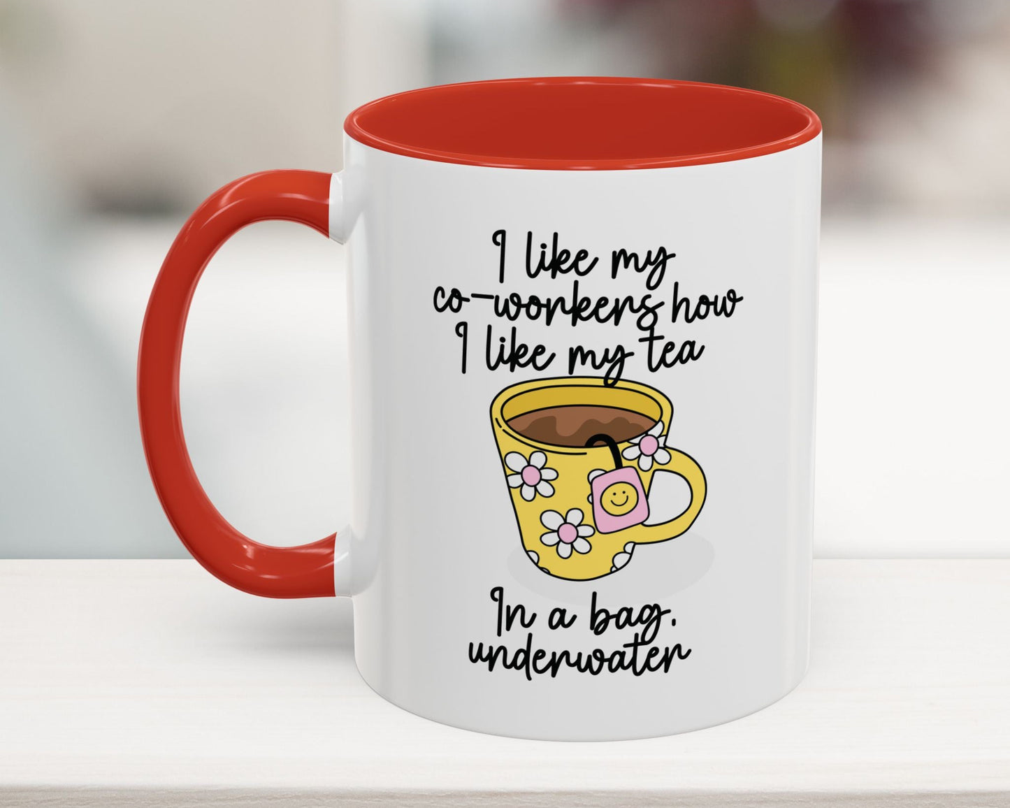 White mug with red interior and handle, featuring a yellow cartoon cup and humorous text.