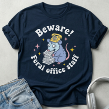 Navy blue t-shirt with a graphic design and text on a light gray background
