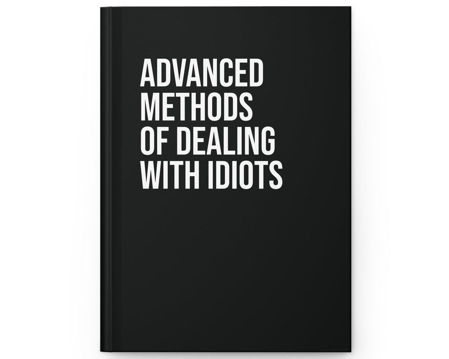 Black book with white text 'Advanced Methods of Dealing with Idiots' on a white background