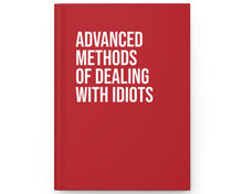 Red book with white text on a white background