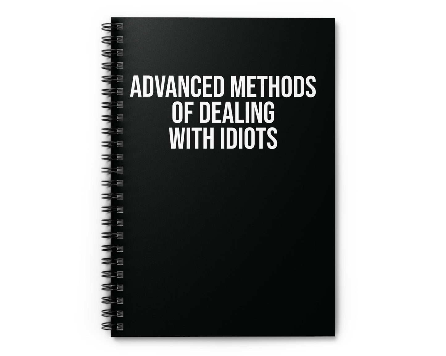 Black notebook with white text on a white background