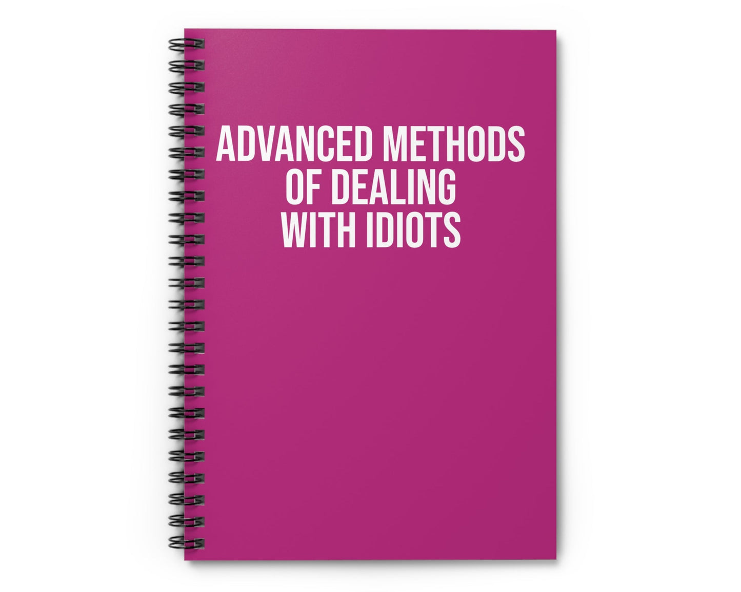 Pink notebook with white text on a white background
