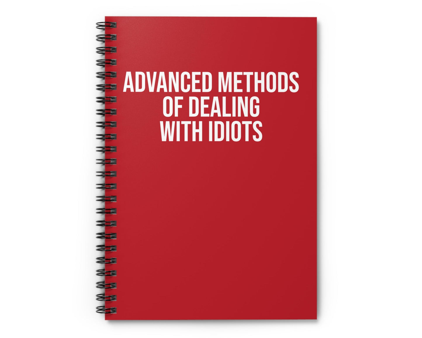 Red notebook with white text on a white background