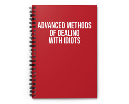 Red notebook with white text on a white background