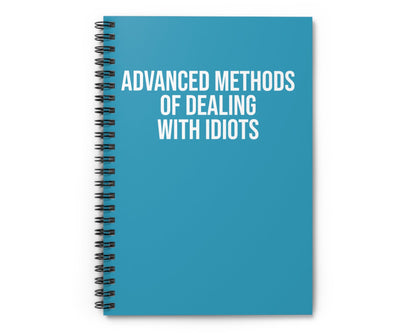 Blue notebook with white text on a white background