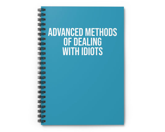 Blue notebook with white text on a white background