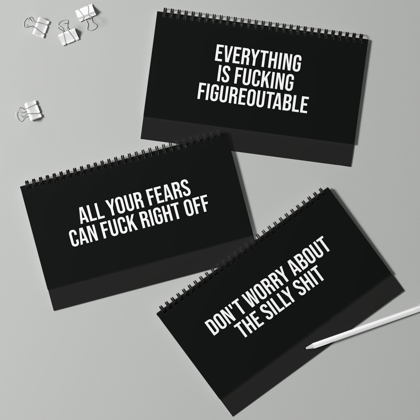 sleek black desk sign with bold feminist motivational text Q2